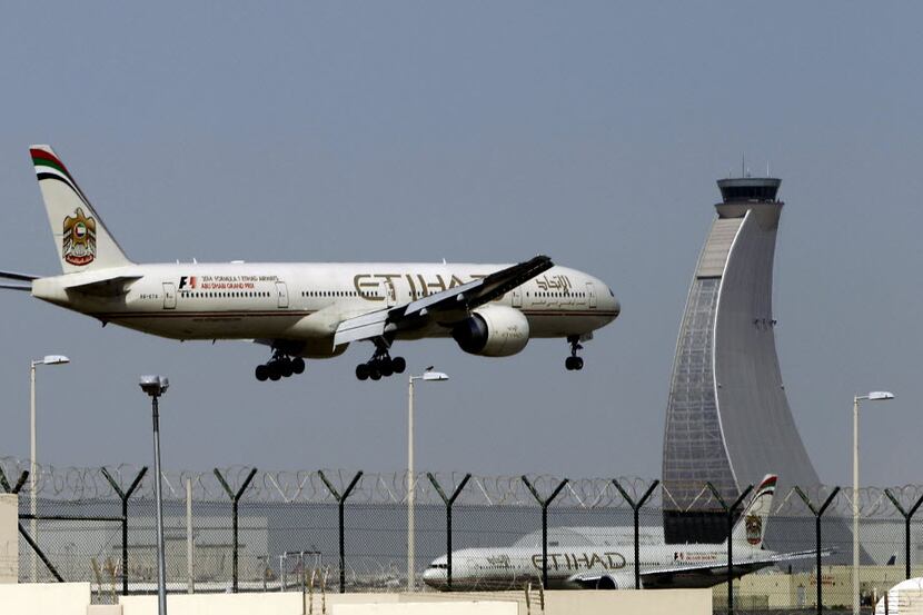 An Etihad Airways plane prepares to land at the Abu Dhabi airport in the United Arab...