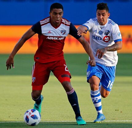 FC Dallas defender Reggie Cannon (2) is defended by Montreal Impact forward Jeisson Vargas...