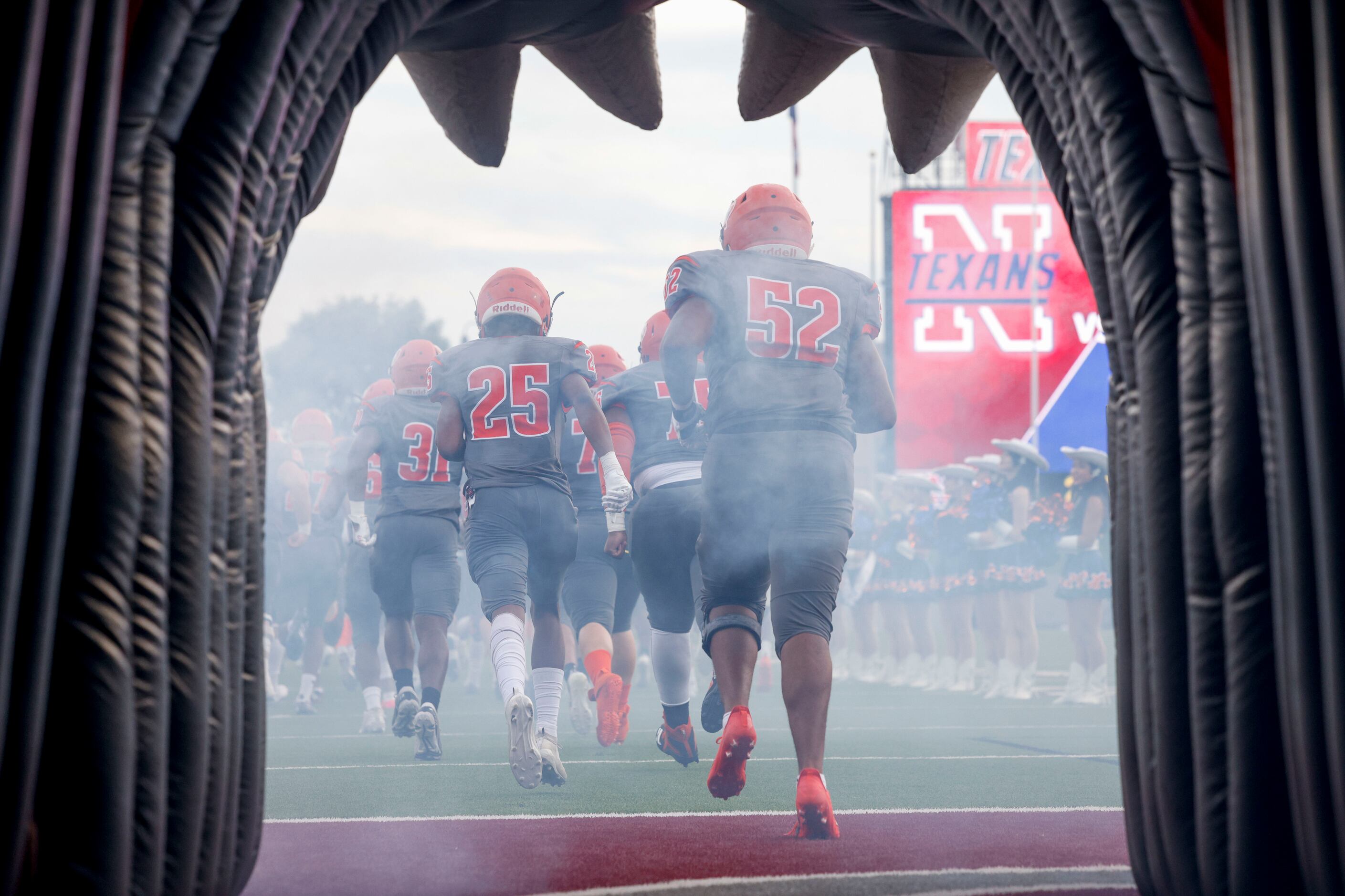 The McKinney North football team takes the field before a game against Justin Northwest at...