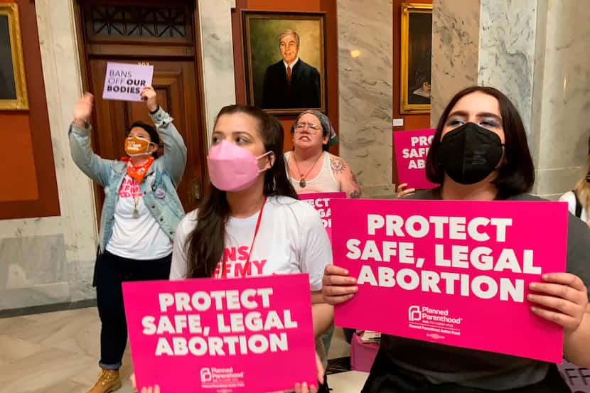 Abortion-rights supporters chant their objections at the Kentucky Capitol on April 13, 2022,...