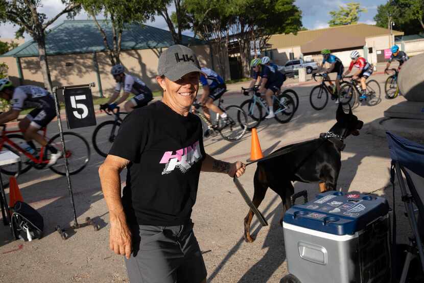 Ginny King founder of King Racing Group walks around as cyclists compete at Fair Park on...