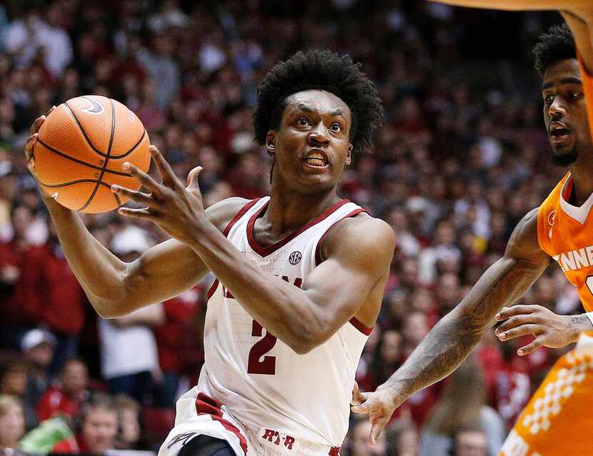 FILE - In this Feb. 10, 2018 file photo, Alabama guard Collin Sexton drives to the basket...