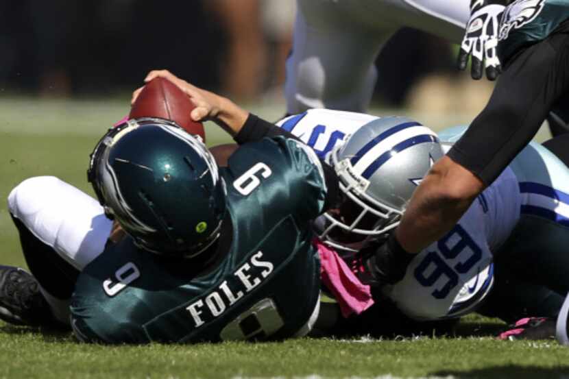 Dallas Cowboys defensive end George Selvie (99) sacks Philadelphia Eagles quarterback Nick...