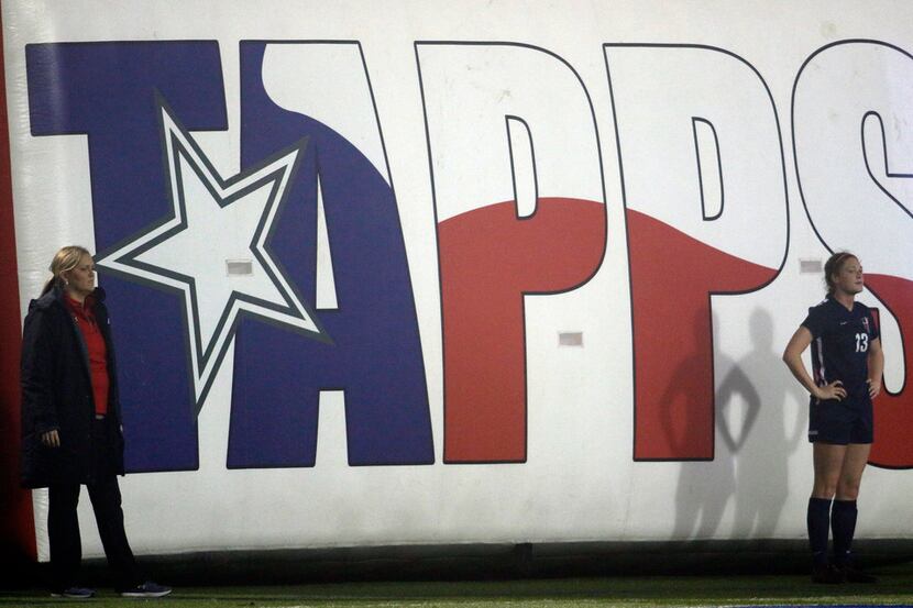 A large TAPPS banner hangs from the stands during a soccer state championship game. (Steve...