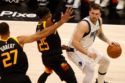 Dallas Mavericks guard Luka Doncic (77) looks to pass as Utah Jazz forward Danuel House Jr....