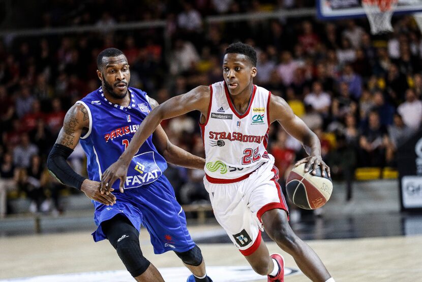 Professional player Frank Ntilikina (right), one of French basketball's promising players,...