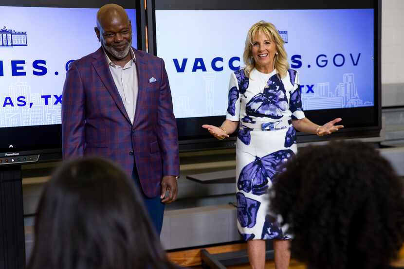 Dallas Cowboys legend Emmitt Smith (left) and First Lady Jill Biden speak to people in the...