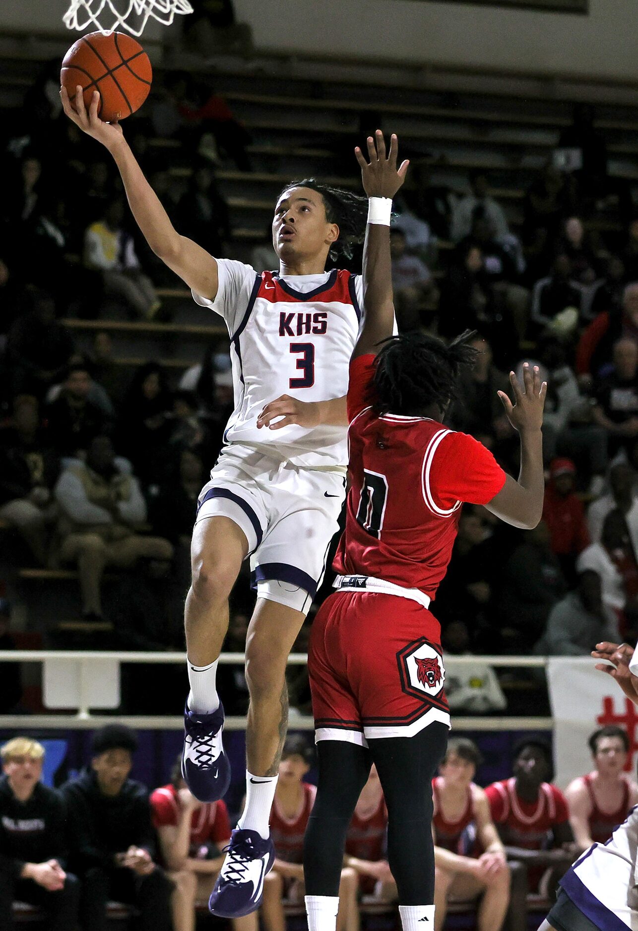 Kimball guard Tylar Hankamer (3) goes in for a layup against Woodrow Wilson guard Jamel...