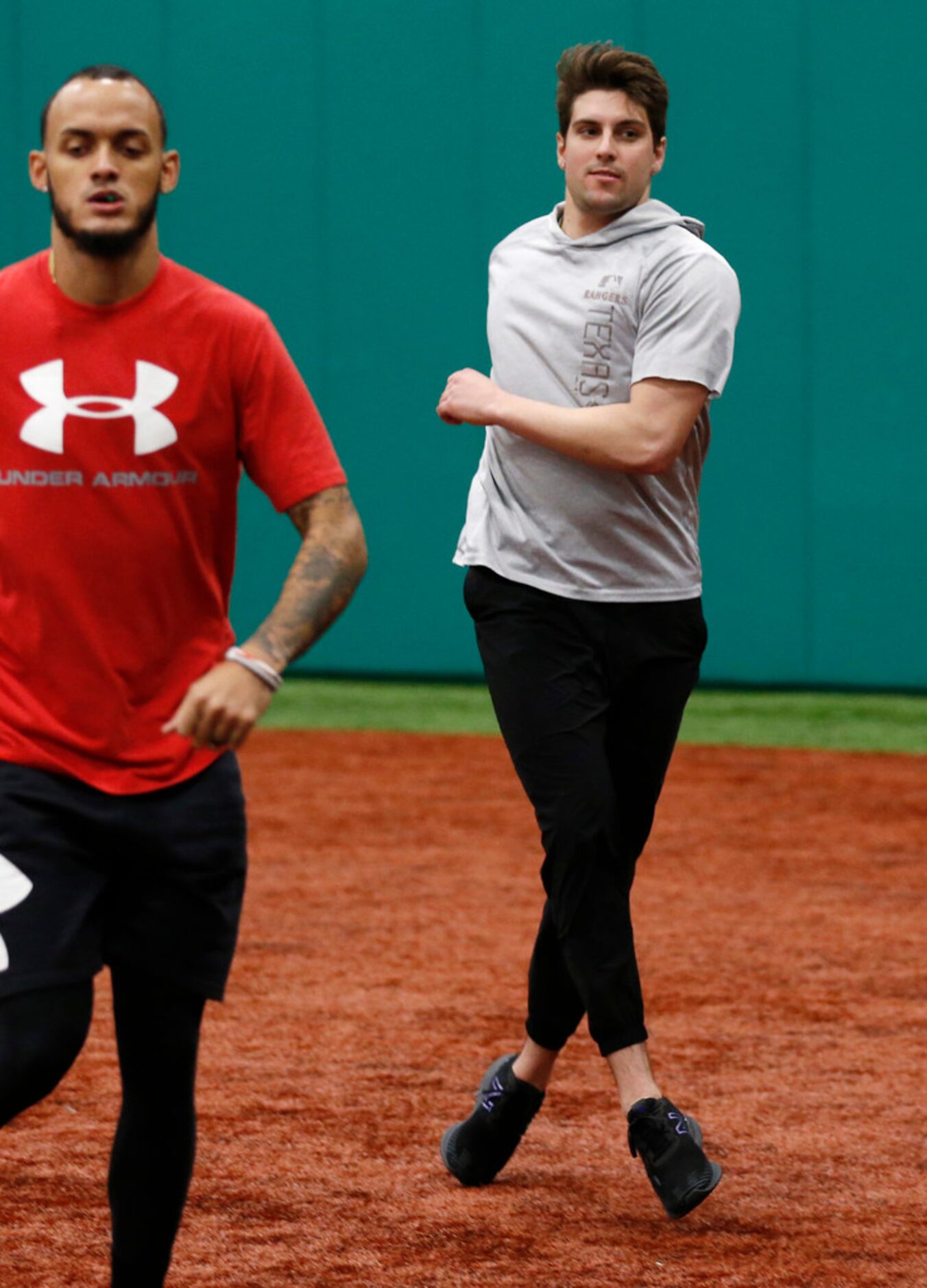 Texas Rangers pitcher Joe Palumbo (62) runs through stretching drills during the Texas...