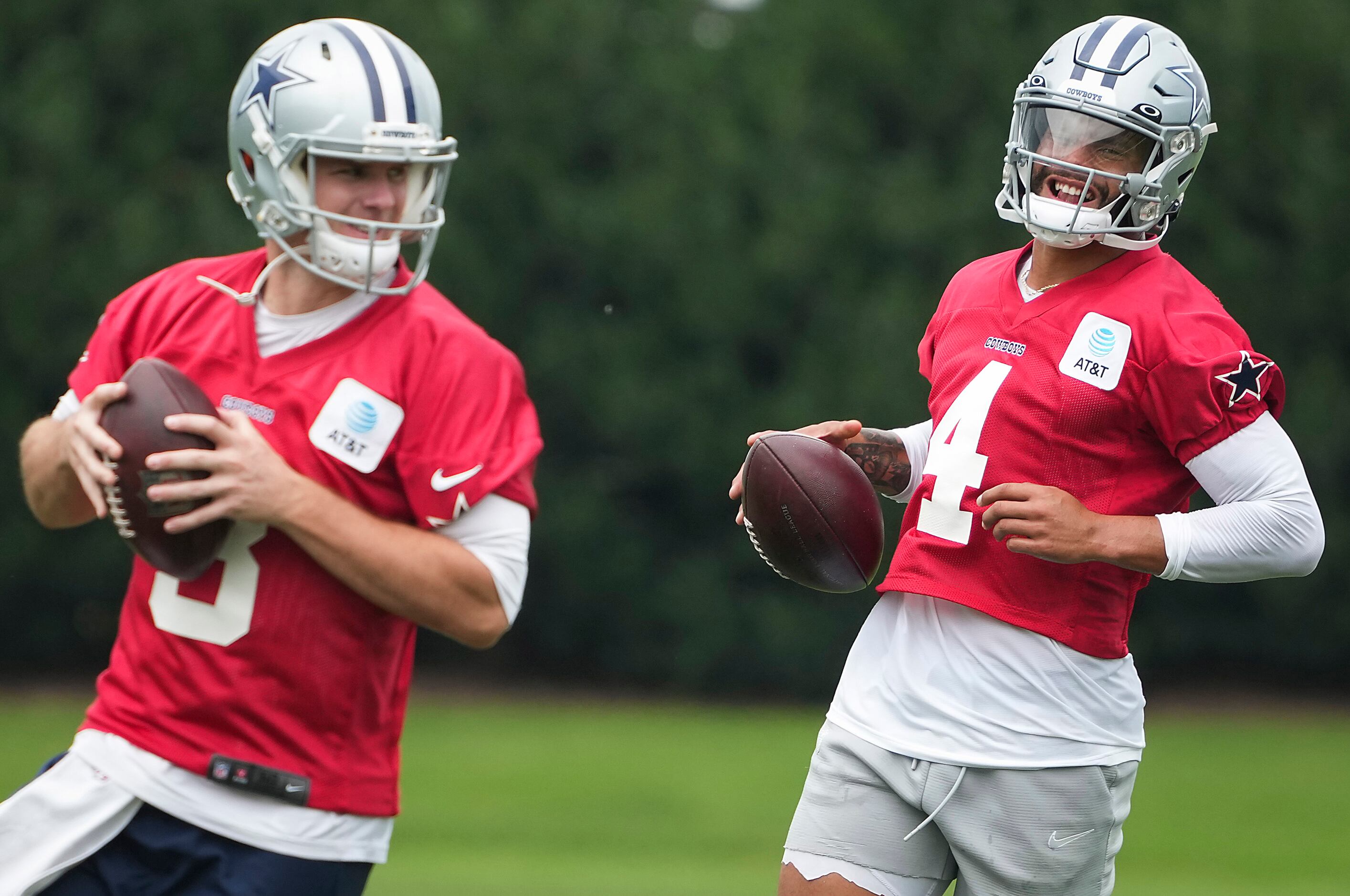 Dallas Cowboys quarterbacks Dak Prescott (4) and Garrett Gilbert (3) participate in a drill...