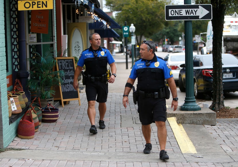 McKinney neighborhood police officers Randy Patton (left) and Sgt. Damian Guerrero patrol...