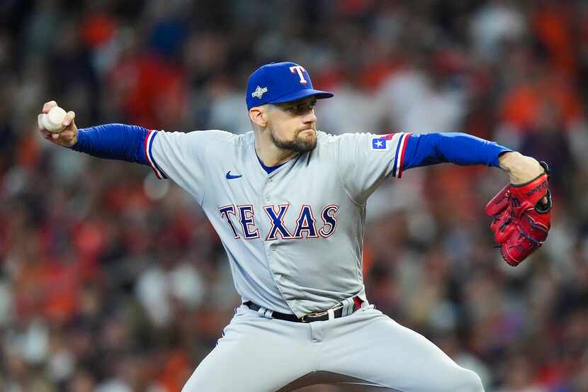 Texas Rangers starting pitcher Nathan Eovaldi delivers during the first inning in Game 2 of...