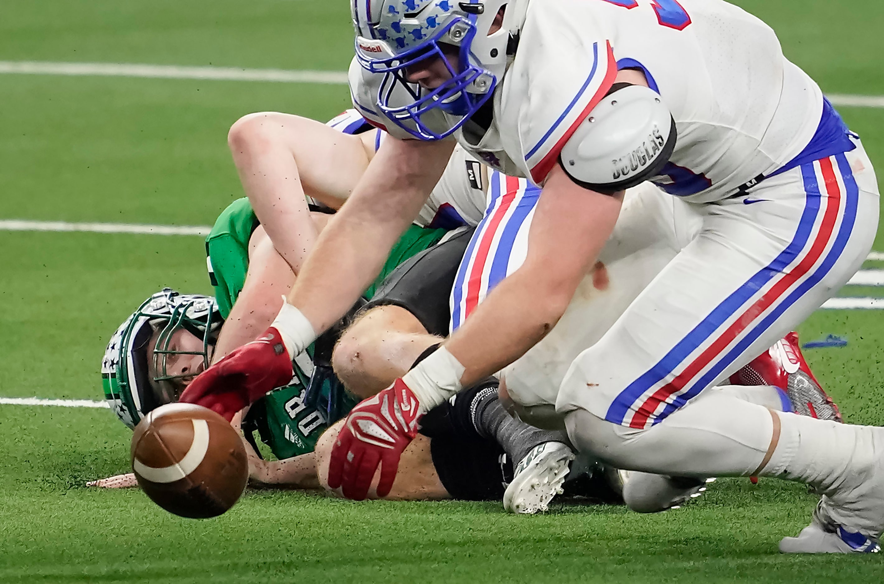 Austin Westlake defensive lineman Braden Davis (95) recovers a fumble by Southlake Carroll...