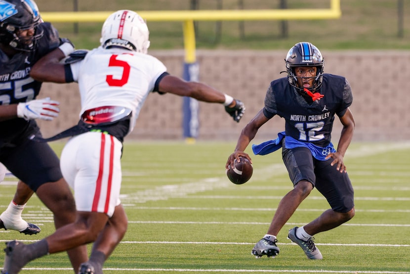 North Crowley quarterback Chris Jimerson Jr (12) scrambles out of the pocket away from...