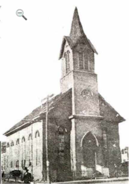  The original structure of Dallas' first church, Sacred Heart Church, which was dedicated in...