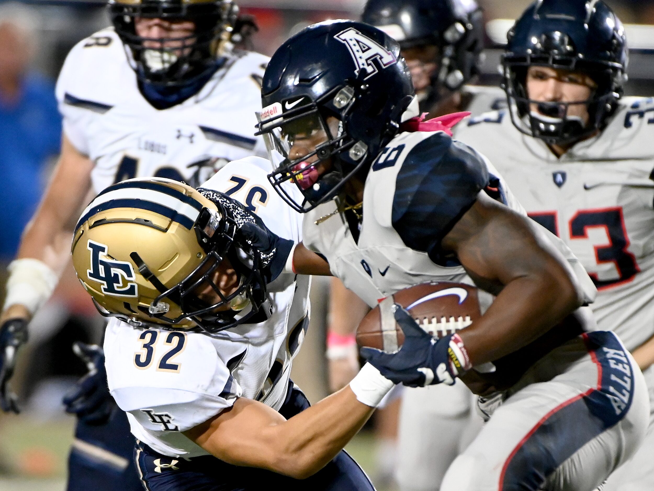 Allen’s Devyn D. Turner (6) stiff arms Little Elm’s D’Lontay Leeks (32) in the first half of...