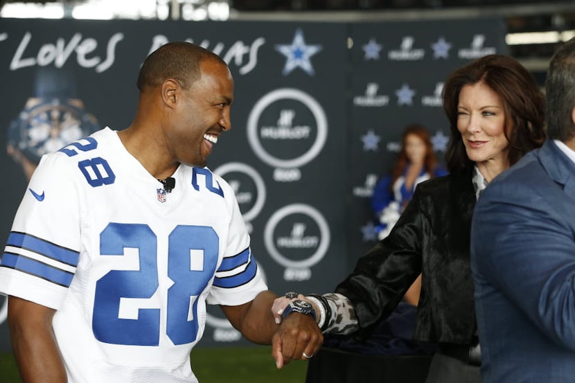 Charlotte Jones Anderson, executive vice president of the Dallas Cowboys winks at former...