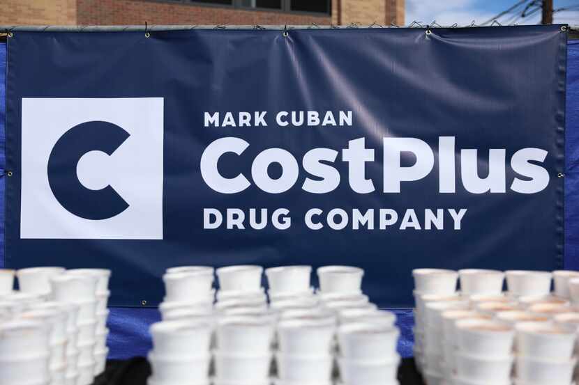 The logo for the Mark Cuban Cost Plus Drug Company sits behind prepared lunches for...