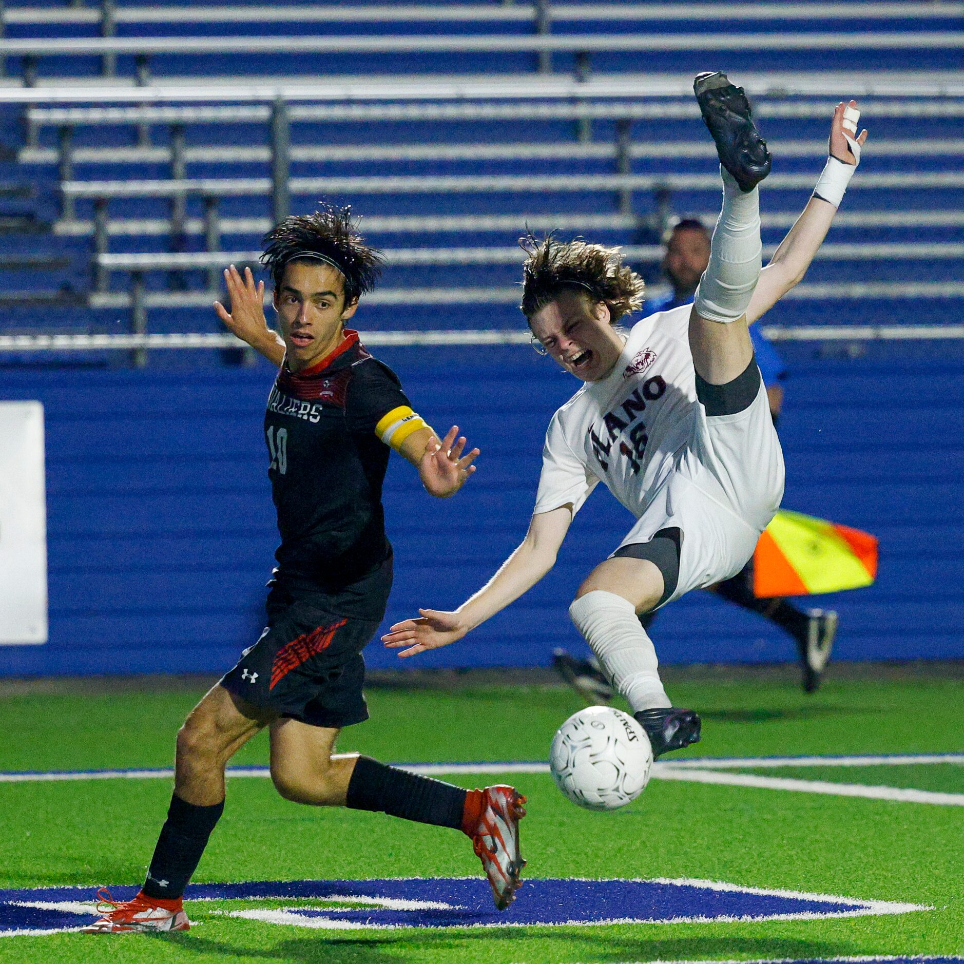 Plano forward Nolan Giles (16) falls to the ground after colliding with Austin Lake Travis...