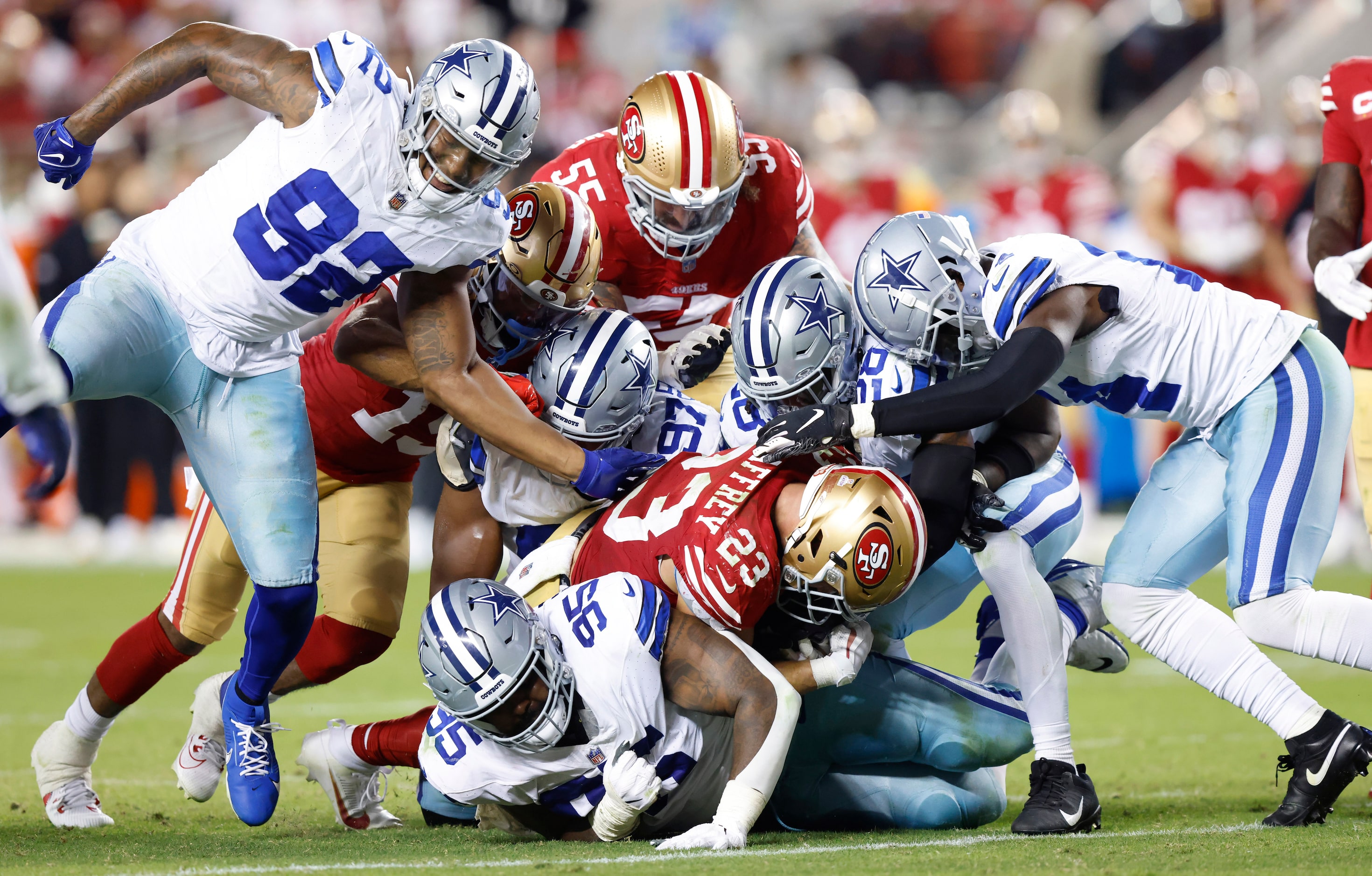 The Dallas Cowboys defense has trouble stopping San Francisco 49ers running back Christian...