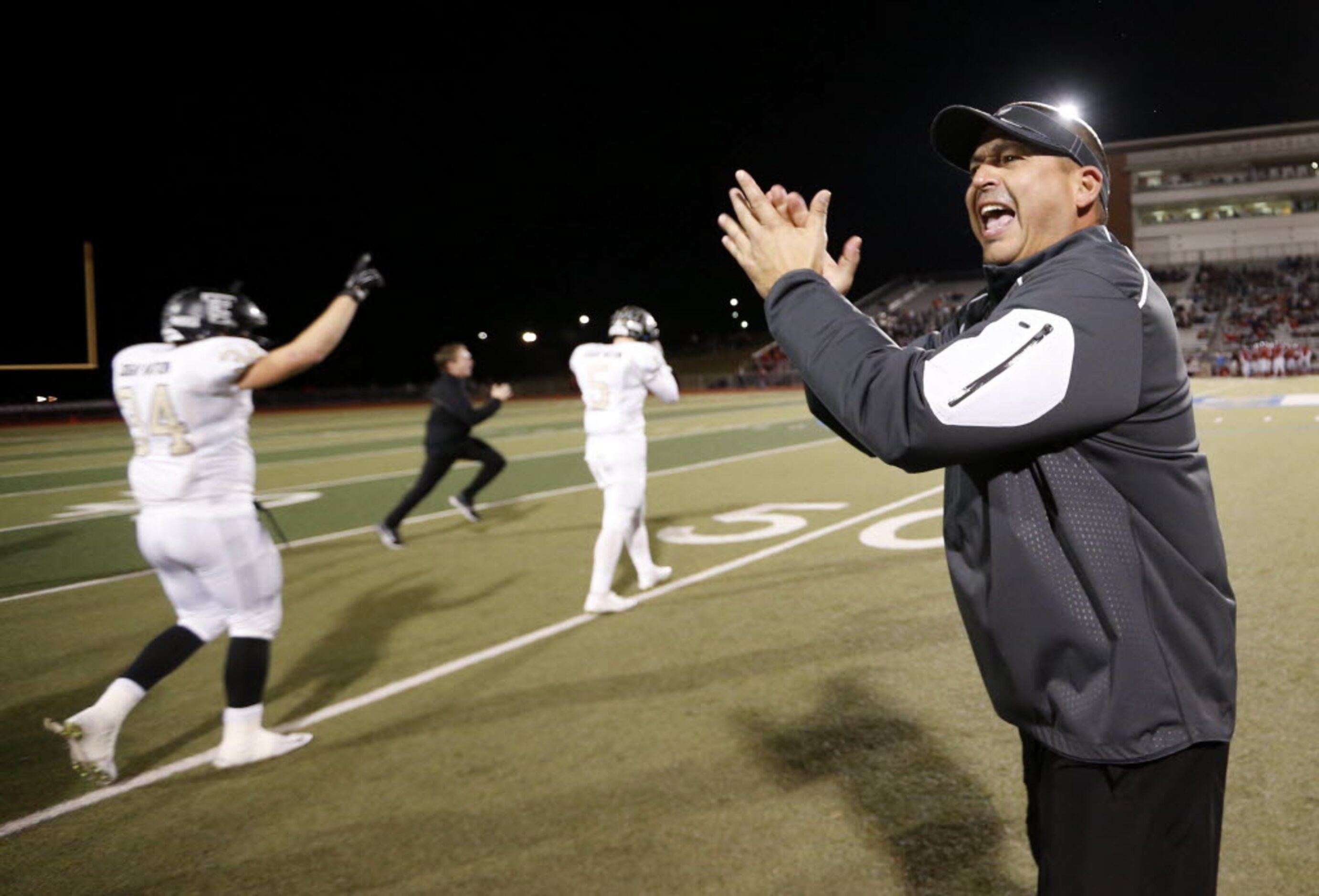 The Colony's head football coach Rudy Rangel celebrates after defeating Frisco Centennial at...