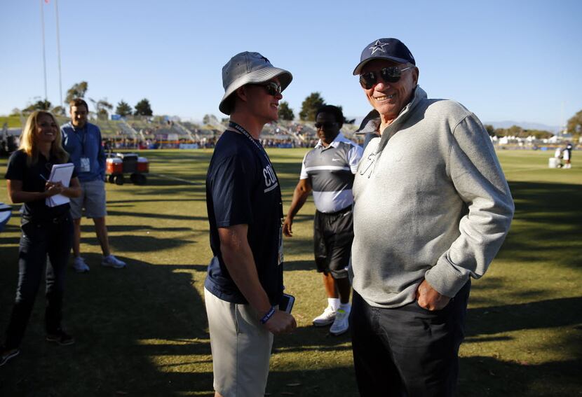 Dallas Cowboys owner Jerry Jones (right) visits with his grandson, Shy Anderson, following...