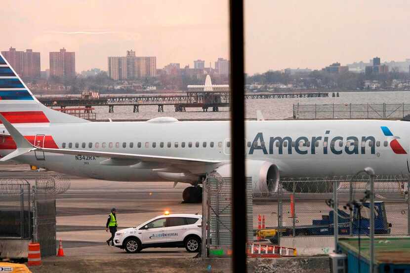 An American Airlines 737 Max sits at the gate at LaGuardia airport in New York.