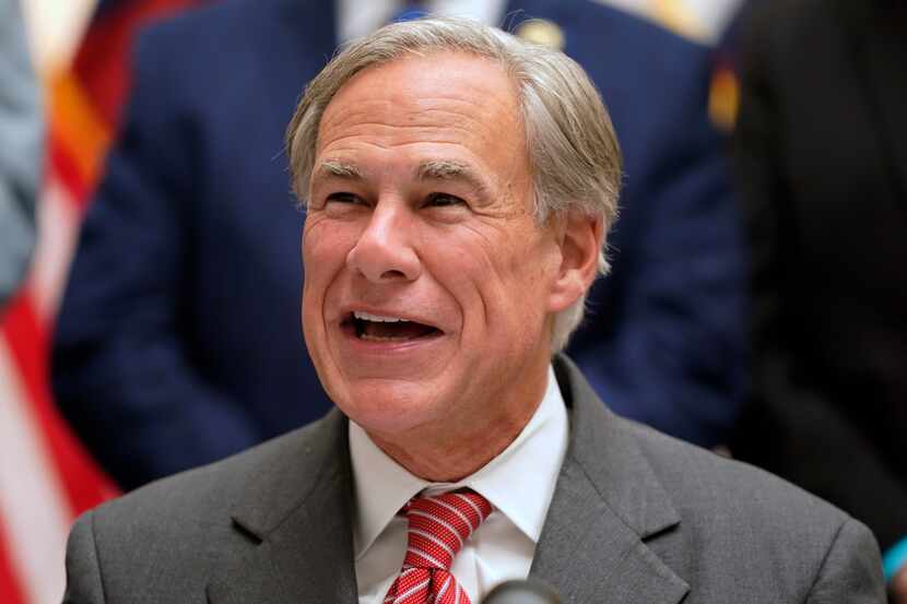 FILE - Republican Texas Gov. Greg Abbott speaks before signing Senate Bill 1, also known as...