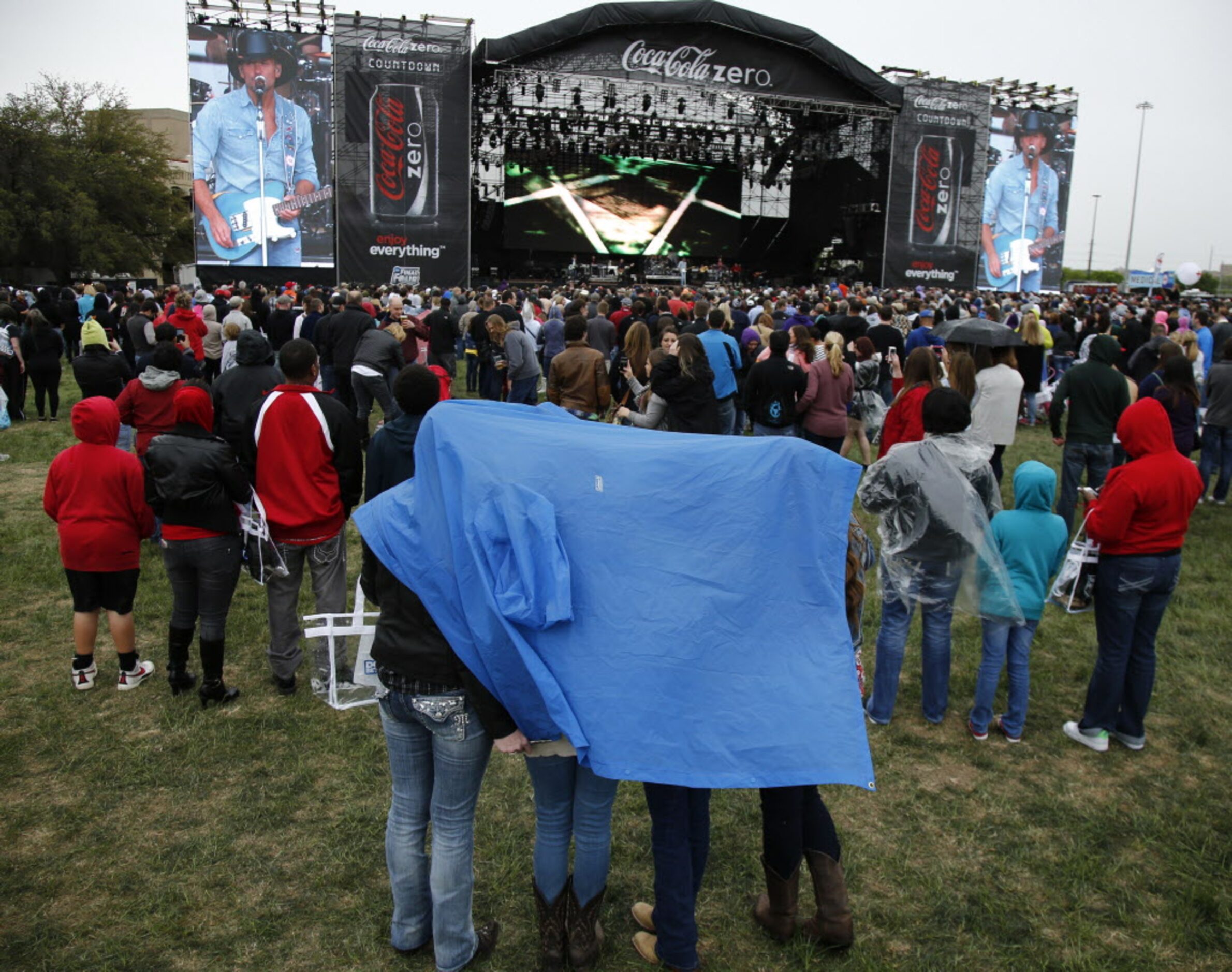 Crowds start to cover up during Tim McGraw's concert at the March Madness Music Festival at...