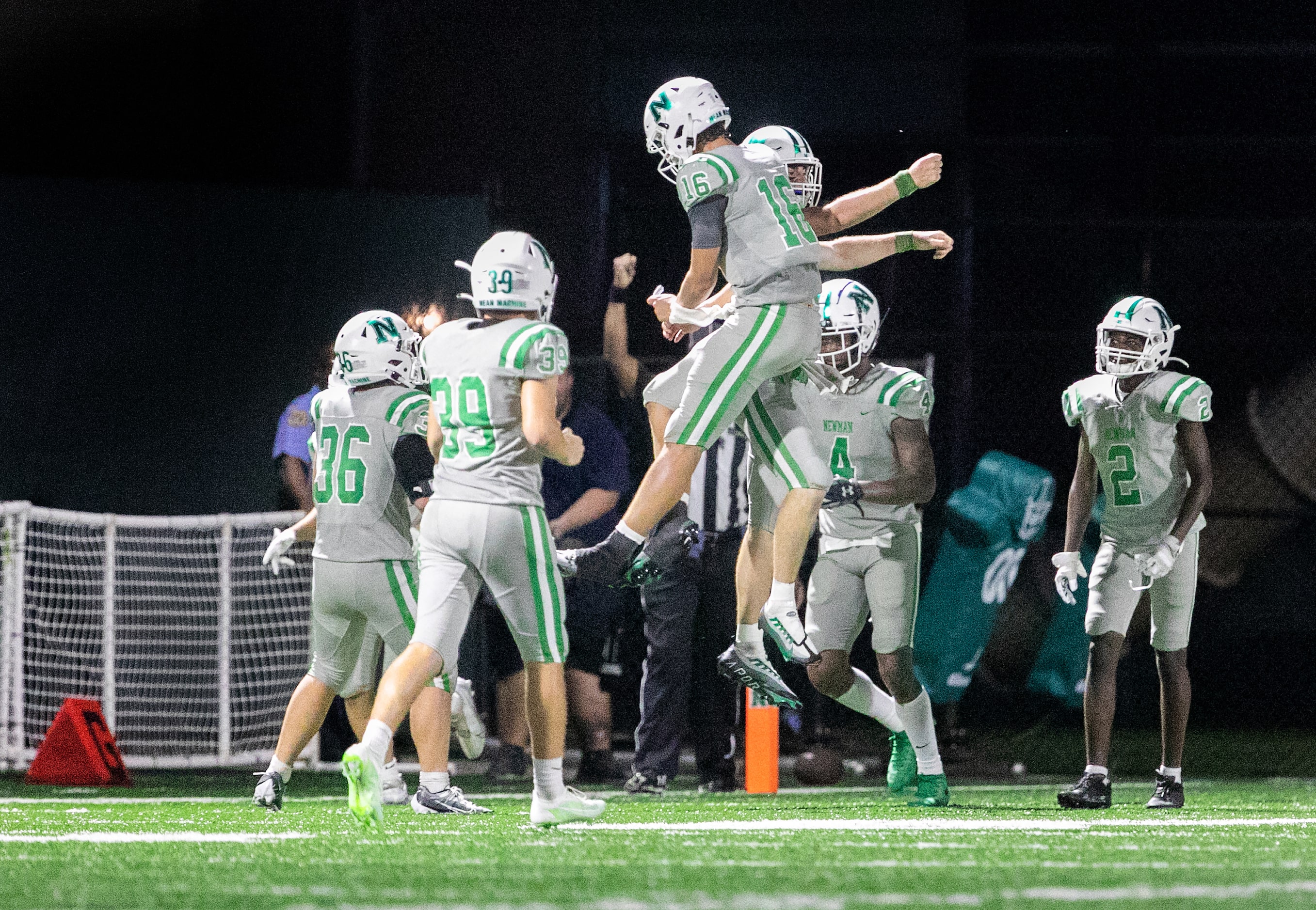 Arch Manning celebrates a touchdown with teammates as Newman High School defeats Riverside...