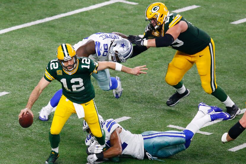 Dallas Cowboys strong safety Barry Church (42) sacks Green Bay Packers quarterback Aaron...