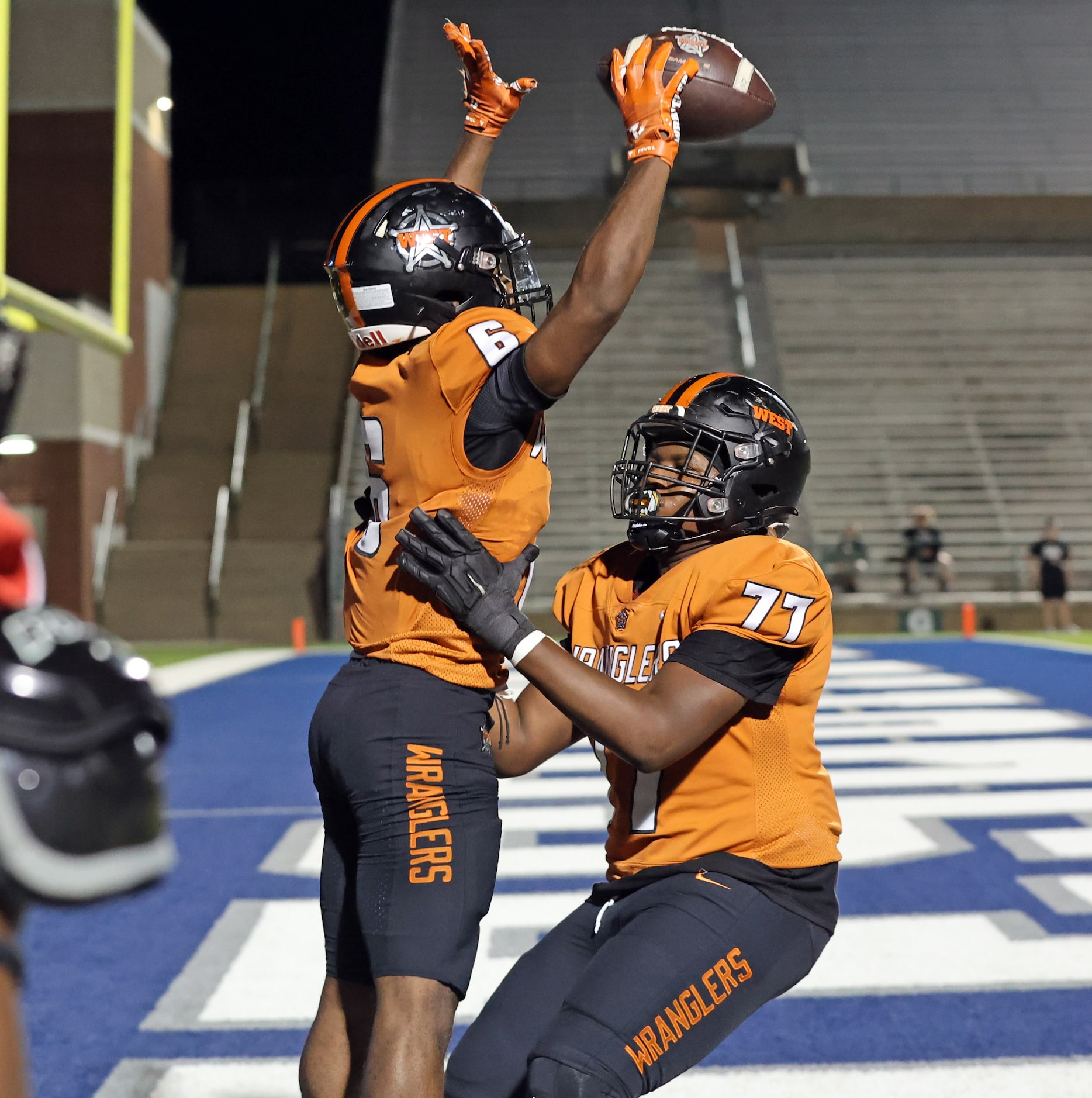 West Mesquite High Richard Clark (6) and teammate Markell Smith (77) celebrate Clark’s...