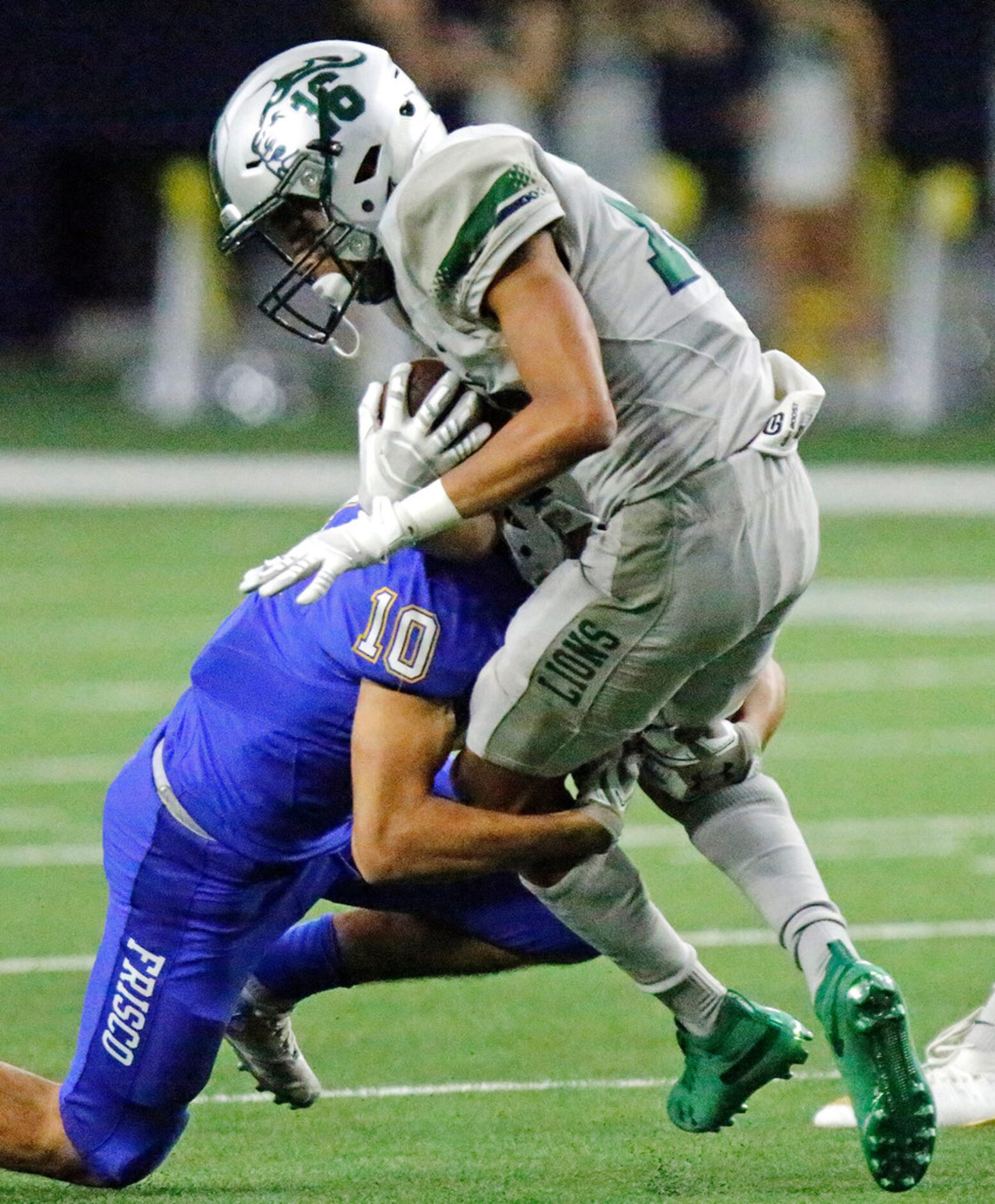 Reedy High School wide receiver Jaylen Fuksa (16) is tackled by Frisco High School defensive...