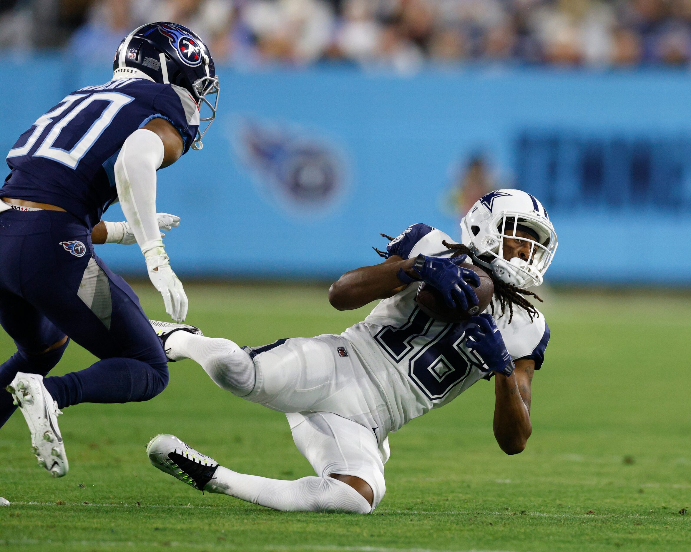 Dallas Cowboys wide receiver T.Y. Hilton (16) falls to the ground after making a catch for a...