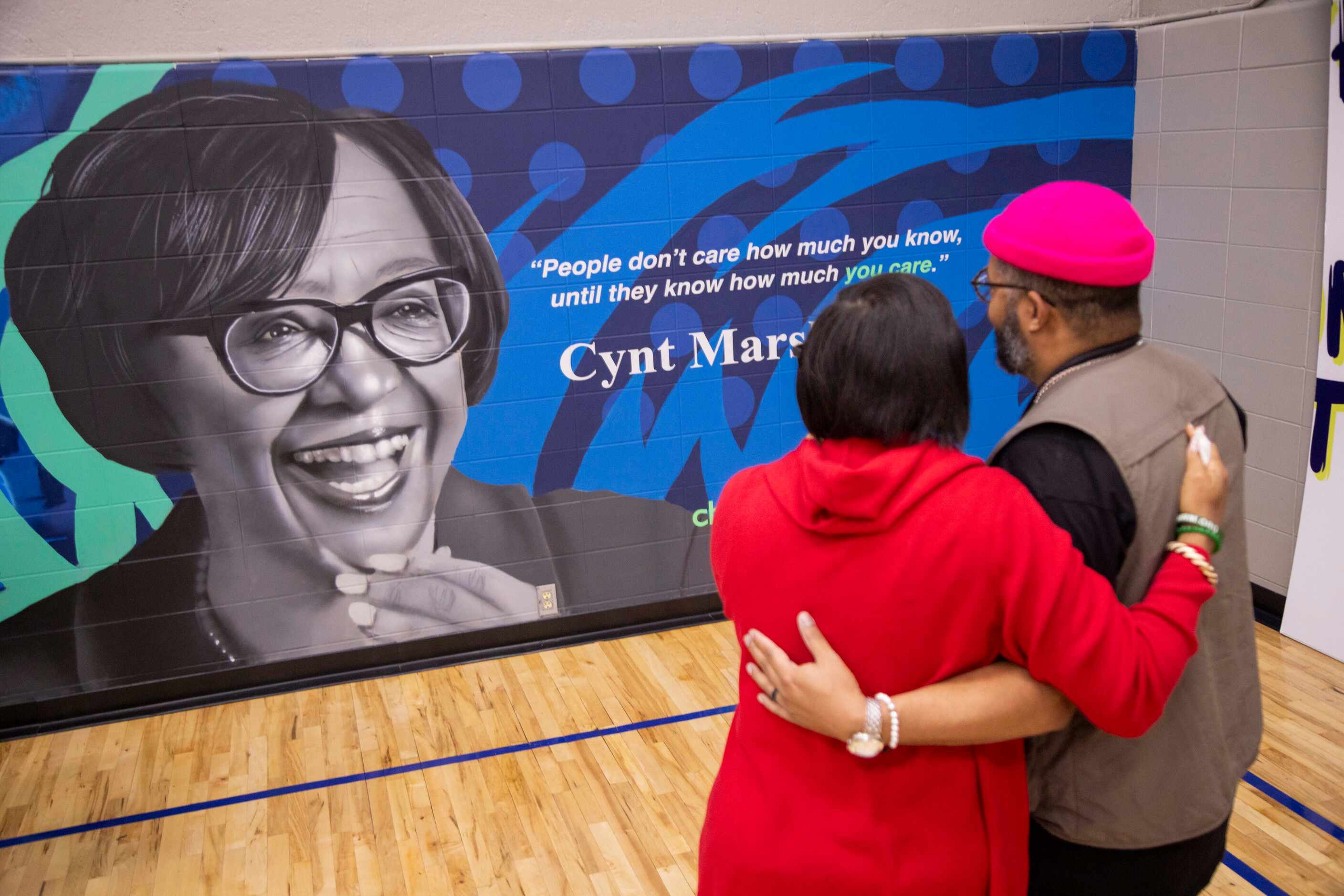 (From left) Cynt Marshall, chief executive officer of the Dallas Mavericks, holds artist...