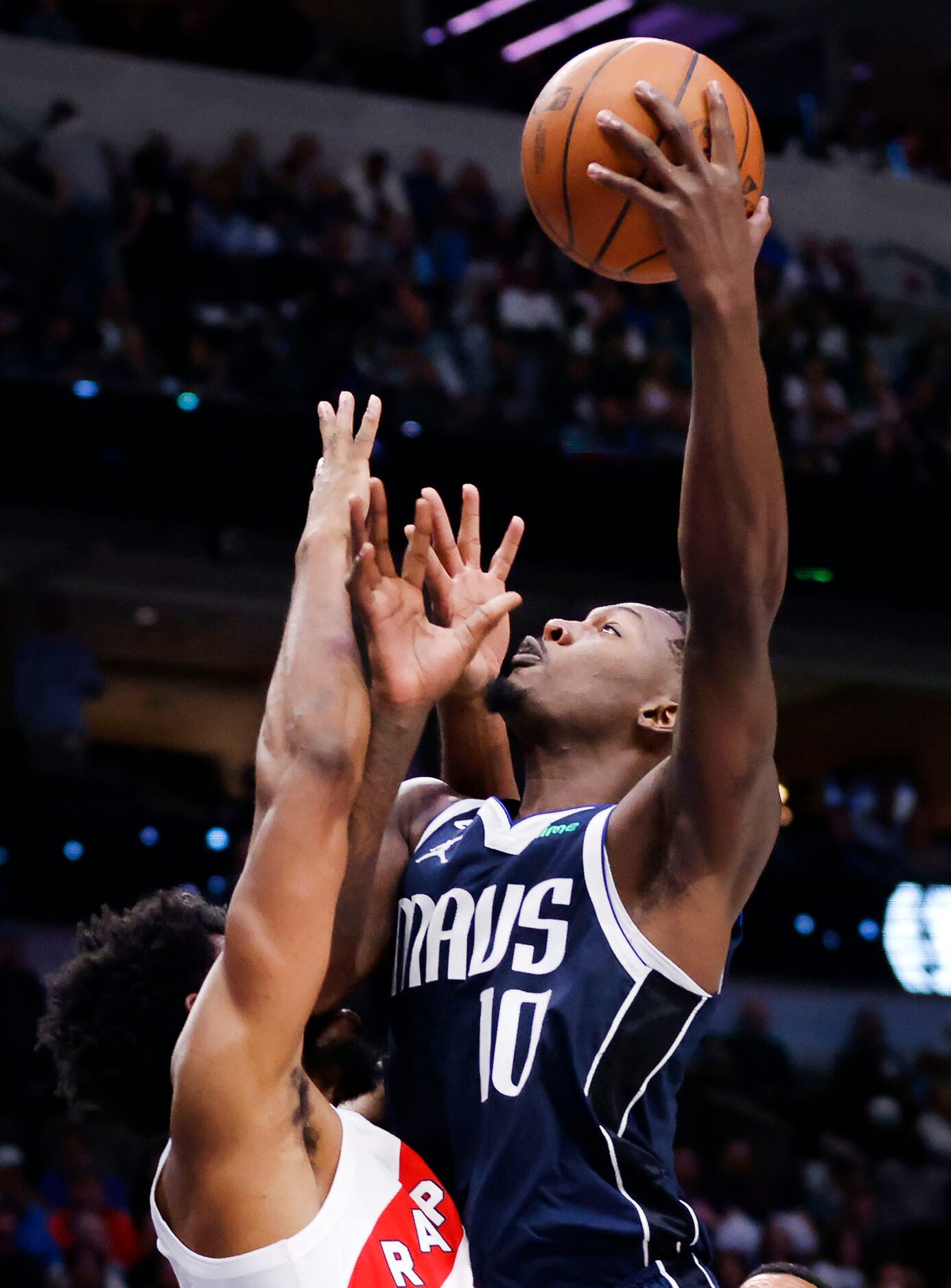 Dallas Mavericks forward Dorian Finney-Smith (10) goes up for a shot against the Toronto...