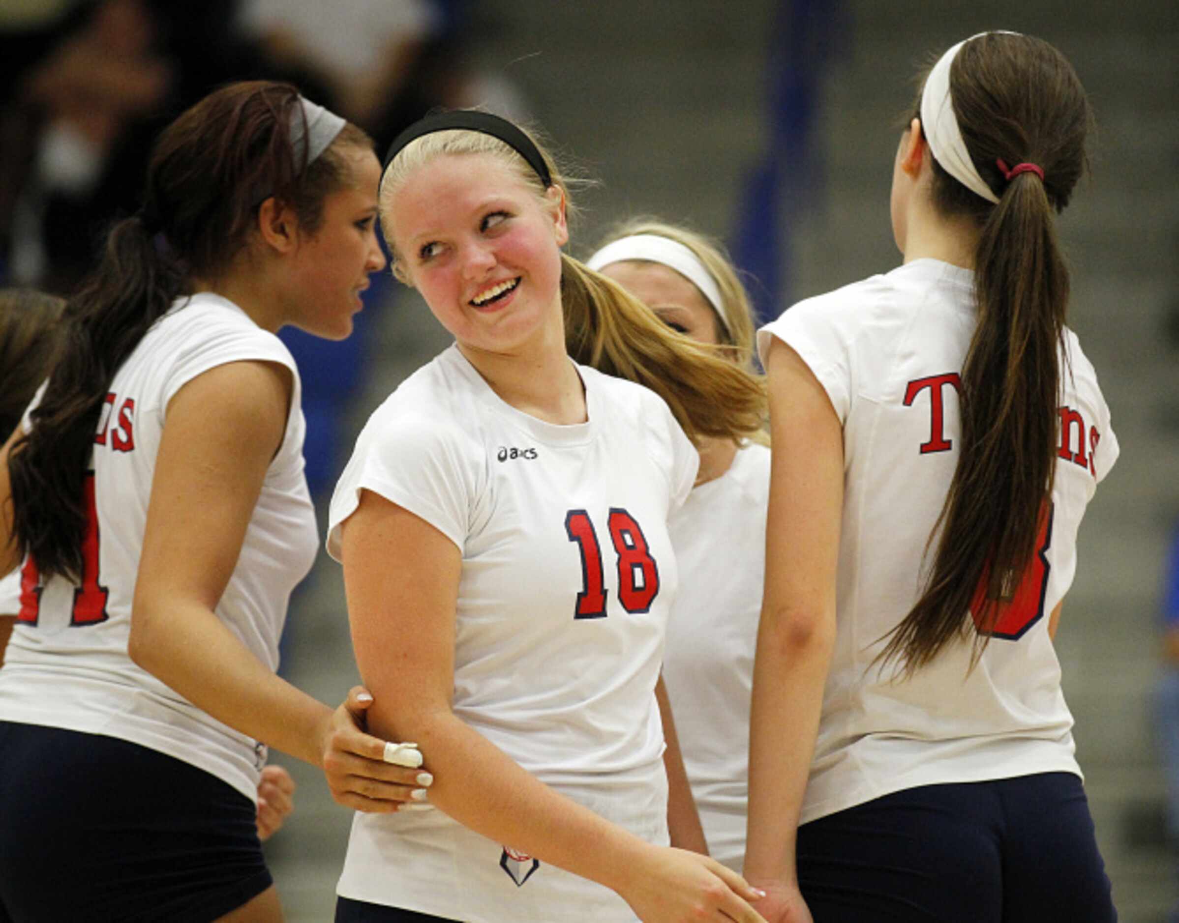 Frisco Centennial's Riley MacDonald (18) is all msiels as her team was up on Frisco High,...