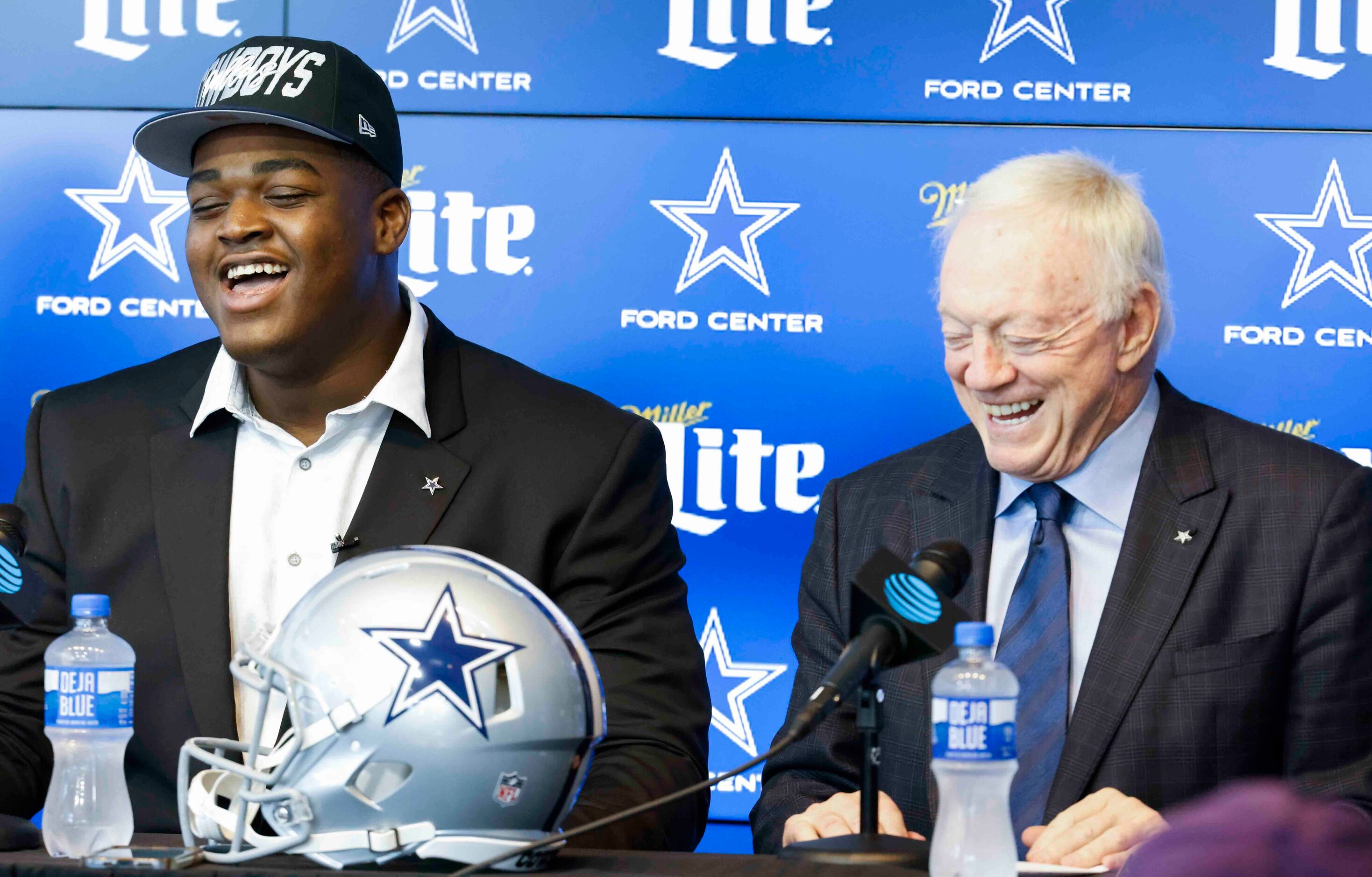 Dallas Cowboys first round draft pick Tyler Smith of Tulsa, left, and owner Jerry Jones...