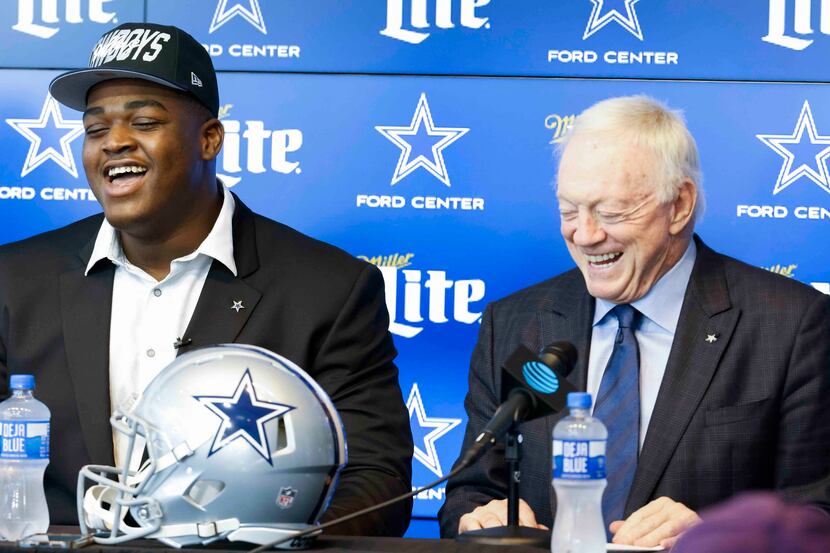 Dallas Cowboys first round draft pick Tyler Smith of Tulsa, left, and owner Jerry Jones...