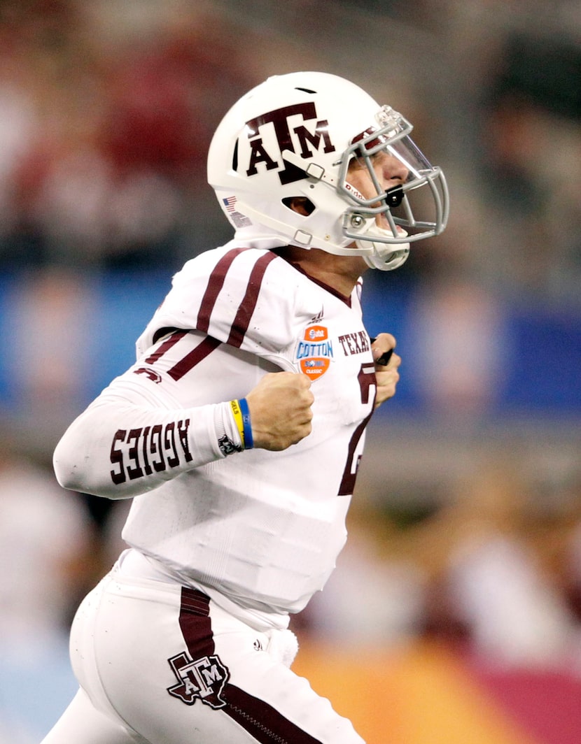 Texas A&M Aggies quarterback Johnny Manziel (2) screams in joy after a touchdown during...