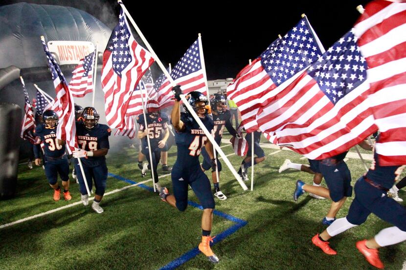 For Veteran's Day, every Sachse player, including James Ferris (45), carried an american...