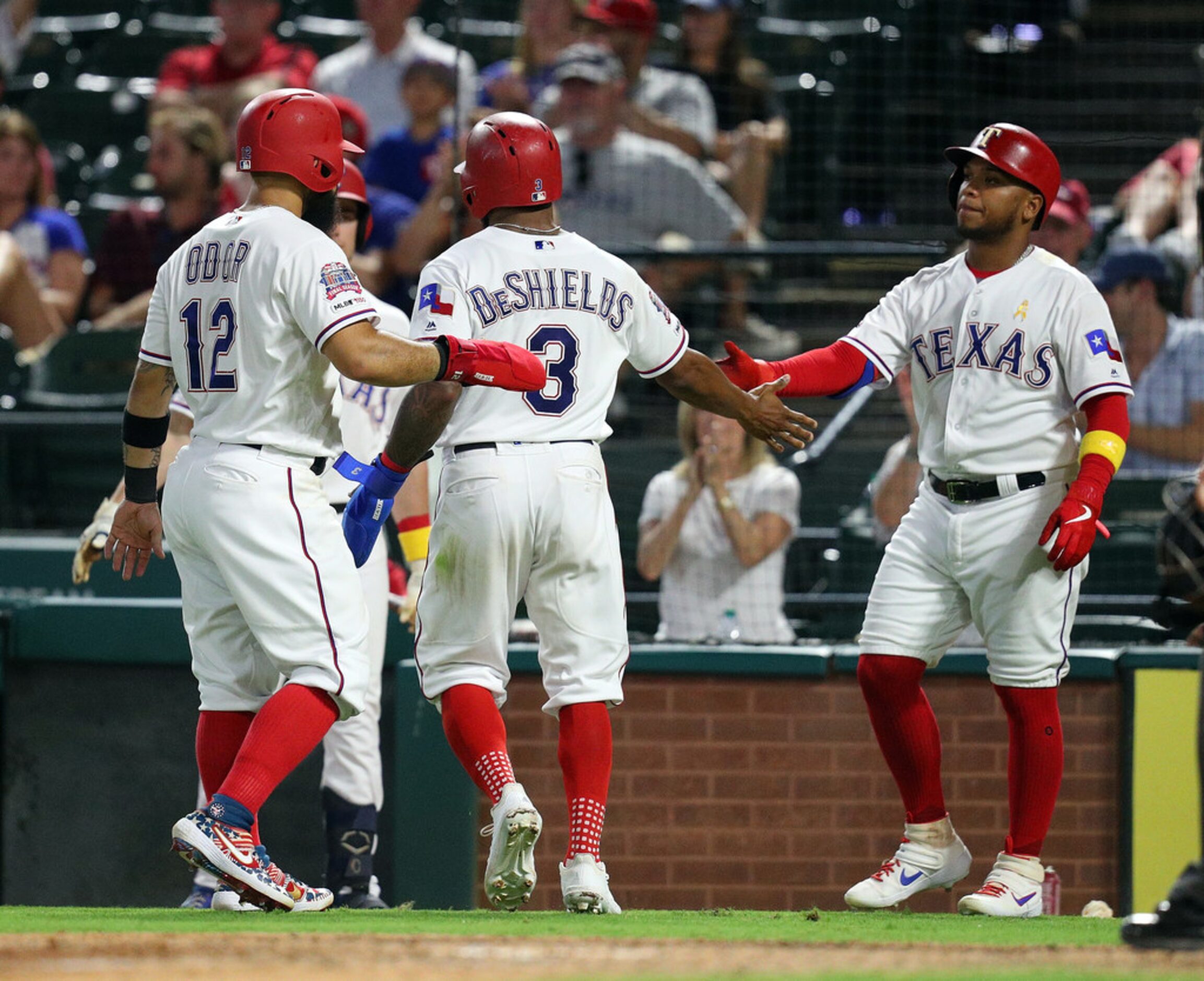 ARLINGTON, TEXAS - SEPTEMBER 13: Rougned Odor #12 and Delino DeShields #3 of the Texas...