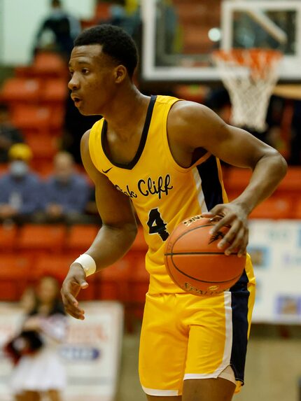 Oak Cliff Faith Family’s TJ Caldwell (4) looks for an opening against Argyle during a boys...