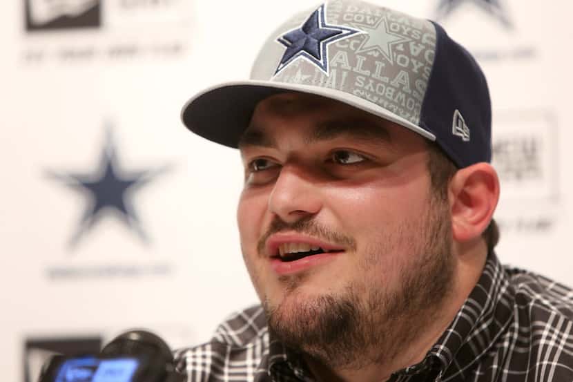 Dallas Cowboys first round pick Zack Martin talks with area media during a press conference...