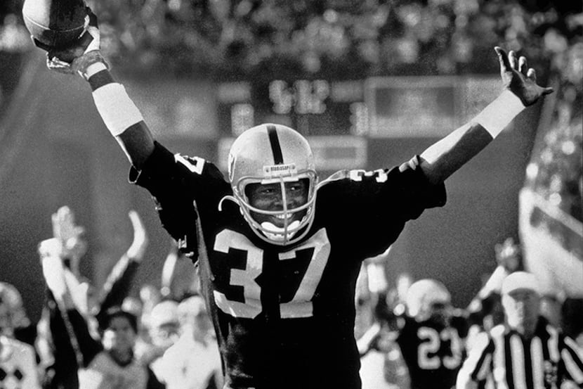  December 31, 1983--Los Angeles Raiders defensive back Lester Hayes exults as he crosses the...