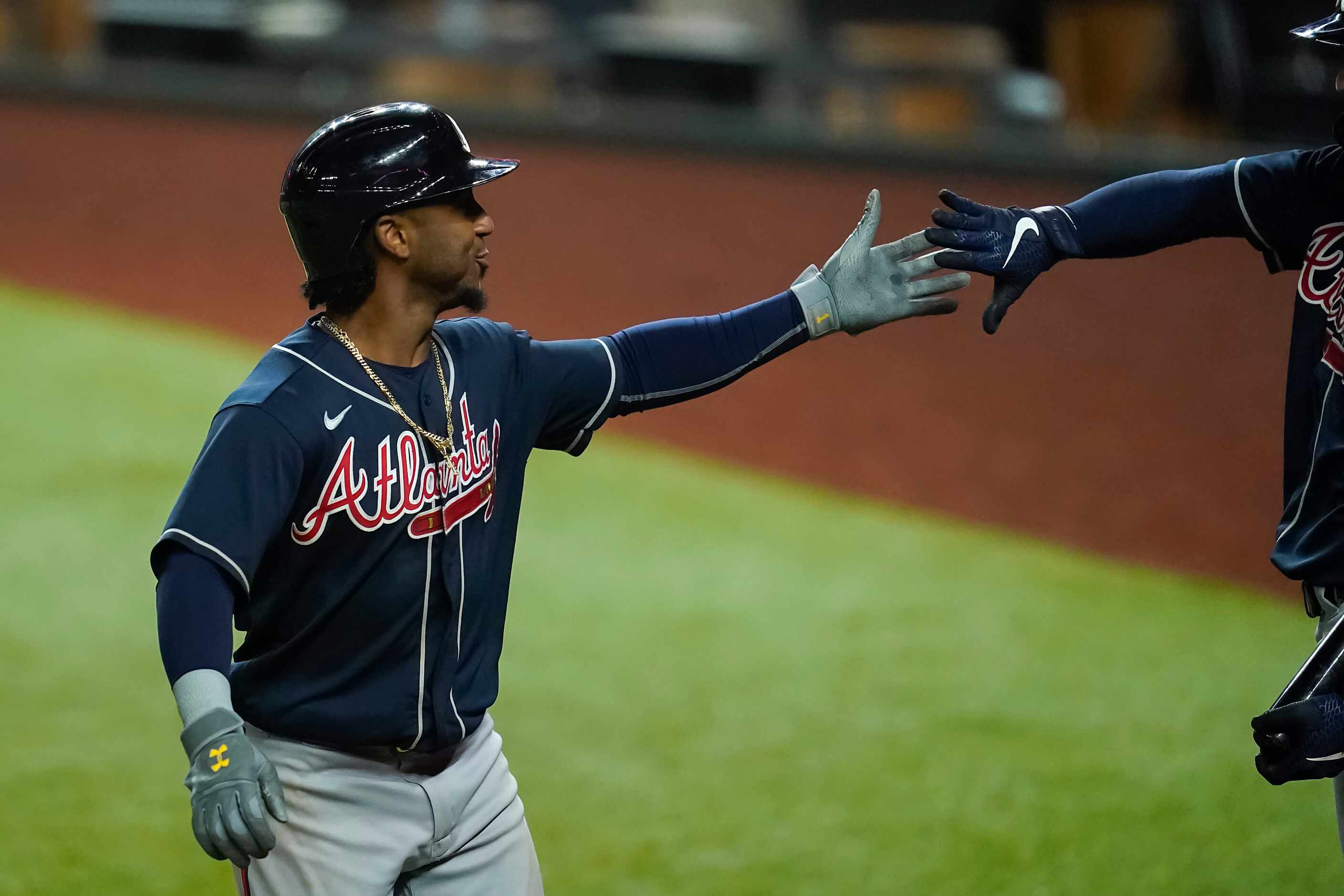 Atlanta Braves second baseman Ozzie Albies celebrates with shortstop Dansby Swanson after...