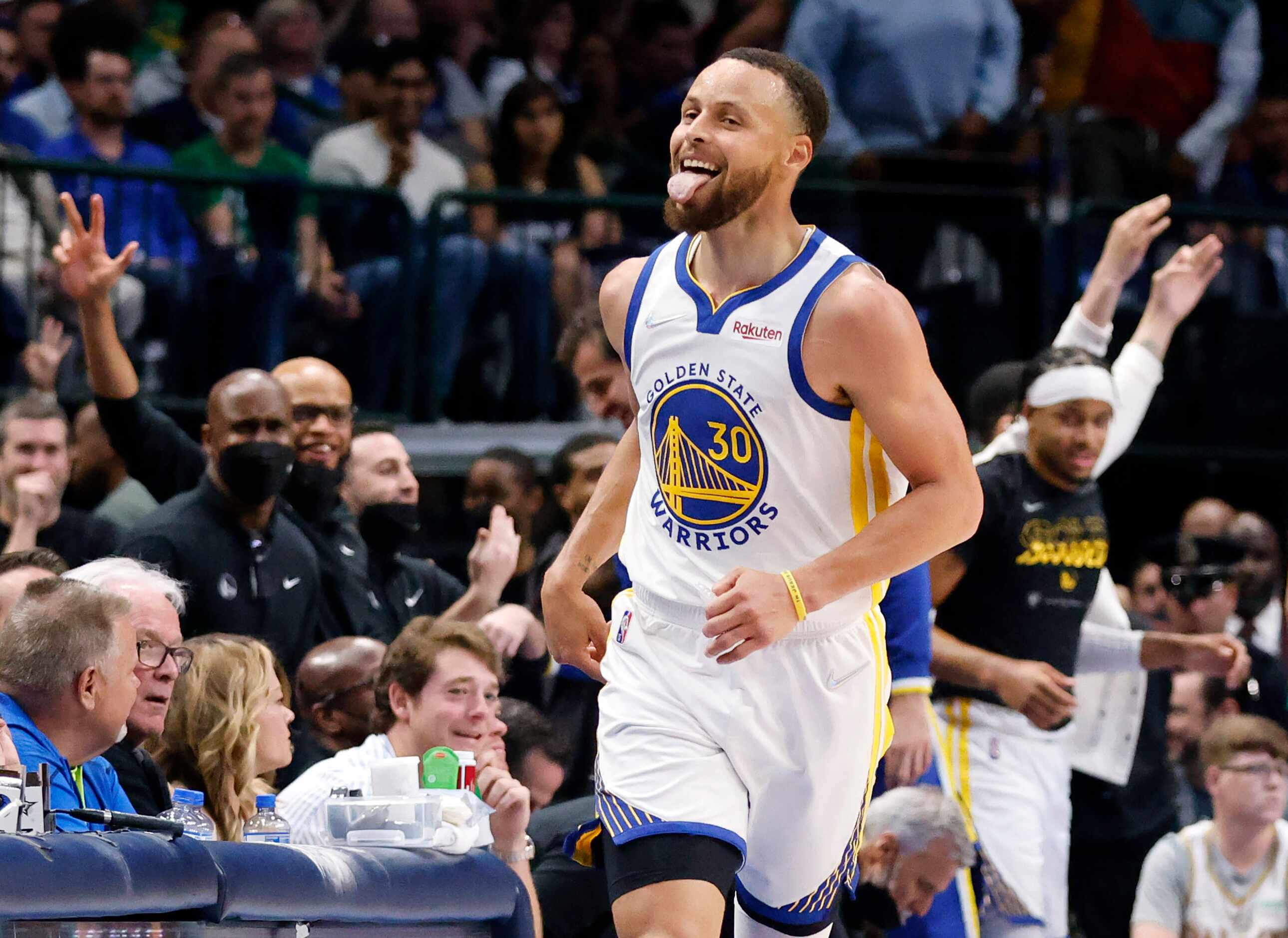 Golden State Warriors guard Stephen Curry (30) sticks out his tongue after hitting a late...