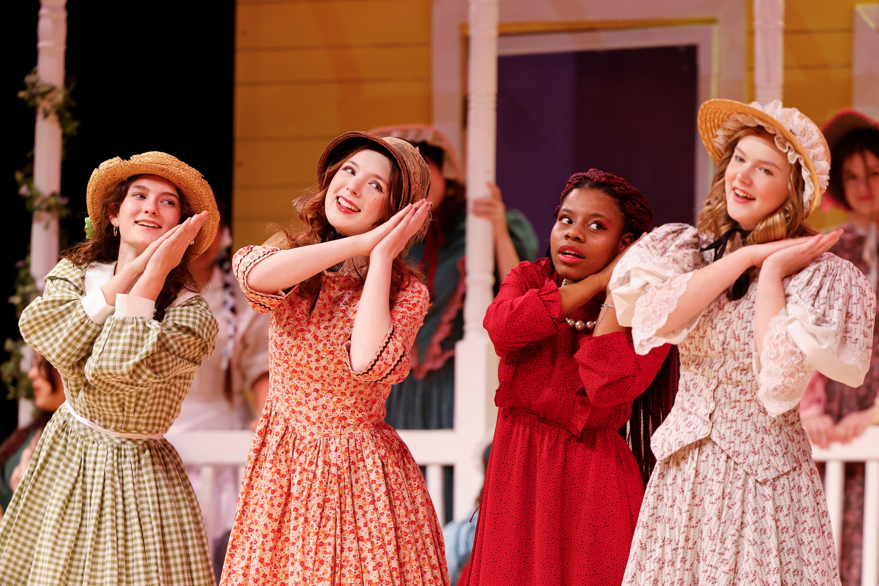 Cast members perform during the opening night of the Sherman High School production of...