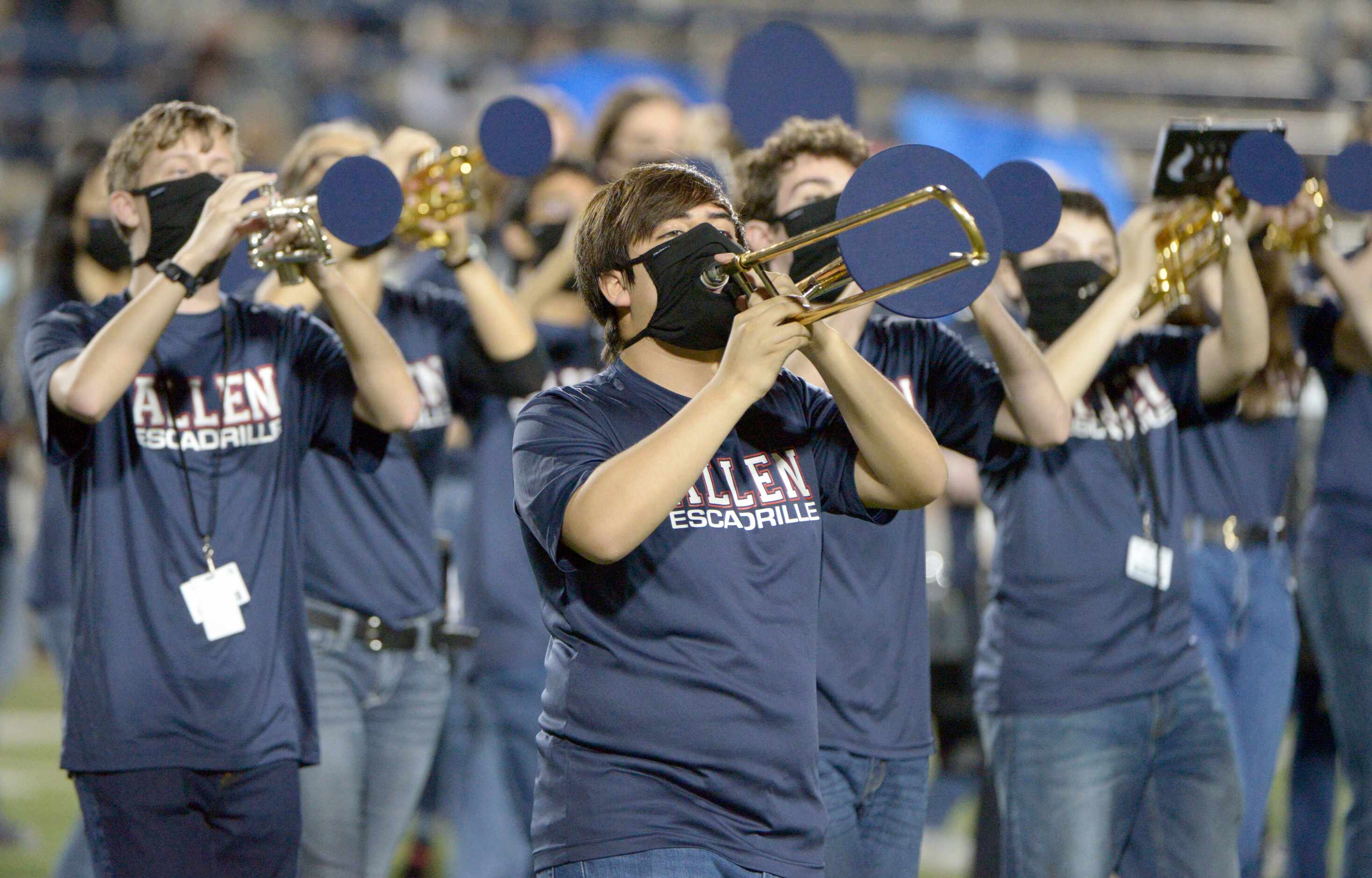 Members of the Allen Escadrille perform at halftime of a high school football game between...