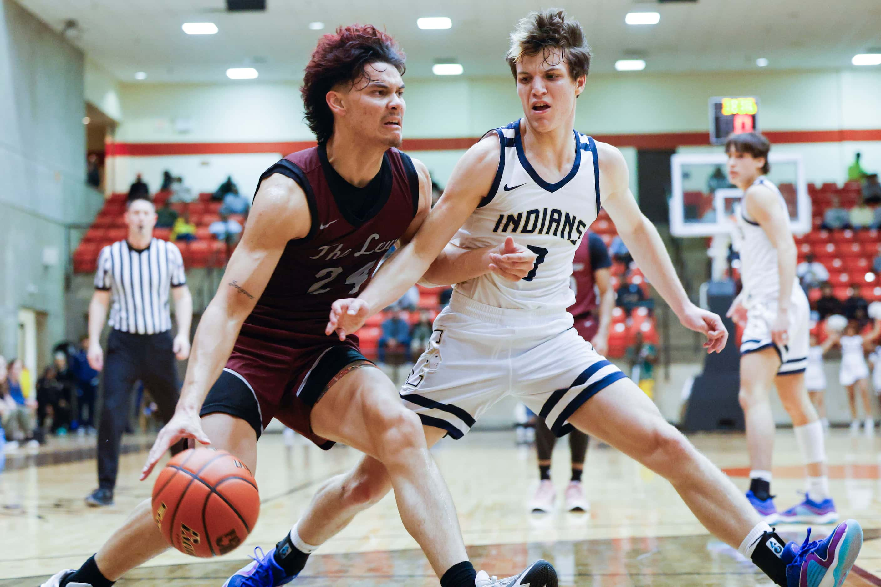 Lewisville High’s Aj Mcpeters (left) dribbles against Keller High’s Quinn Estep during the...